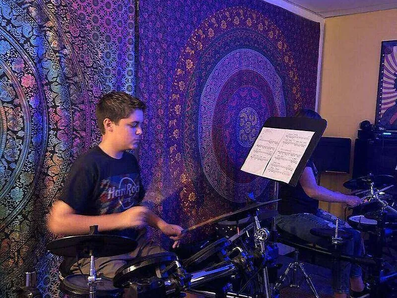 Student taking a private one-on-one drum lesson at Mojo's Music Academy in Longmont, CO