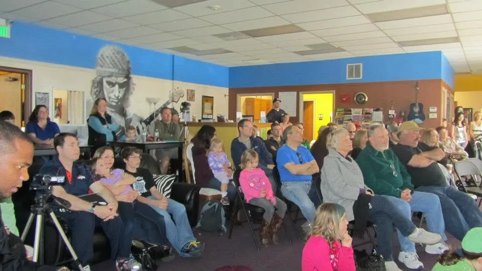 Audience seated at a Mojo's Music Academy student recital