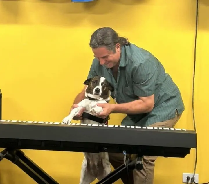 Paul Rogalski with Koko, the Mojo's Music Academy mascot, at the studio