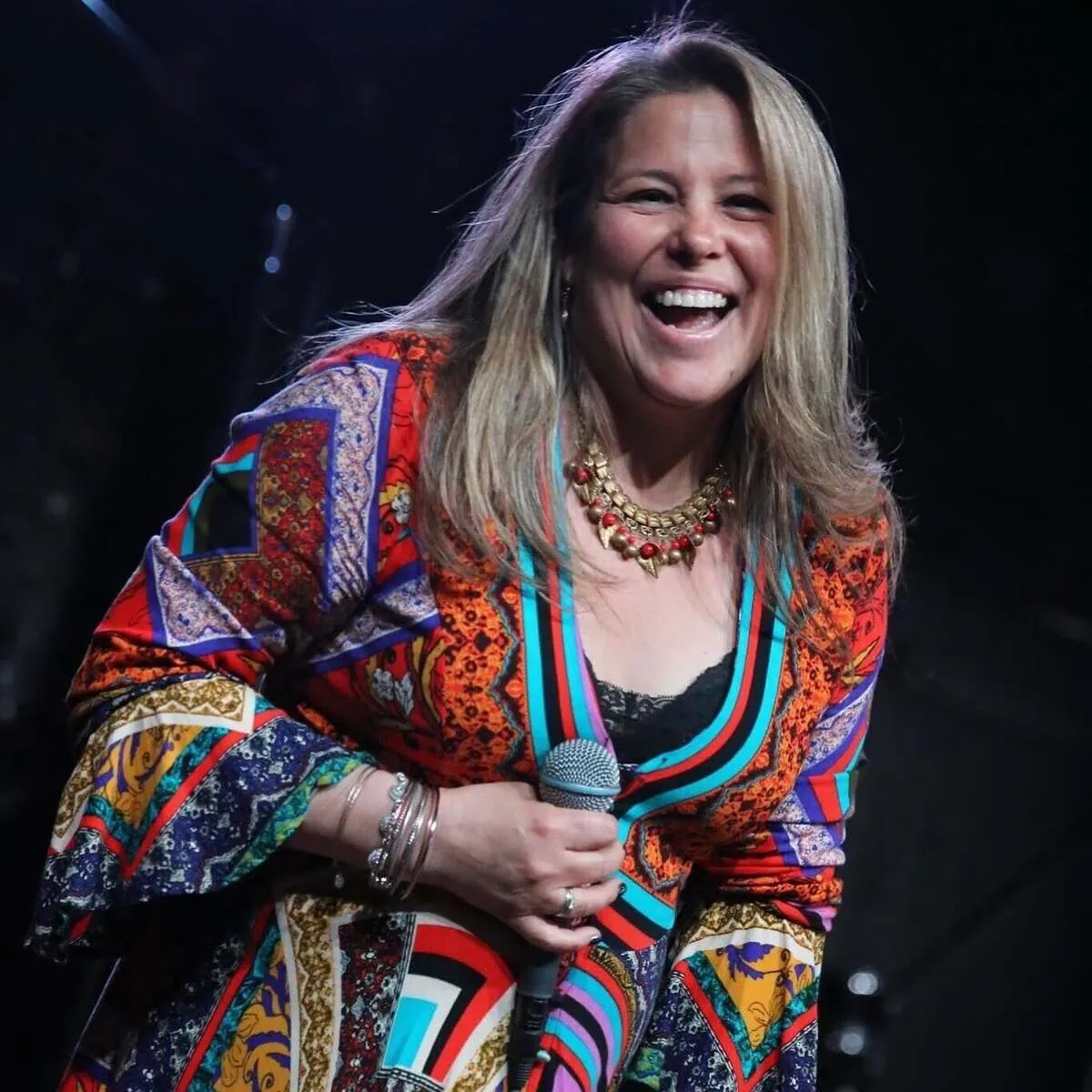 Jessica Rogalski performing on stage, voice teacher and co-founder at Mojo's Music Academy